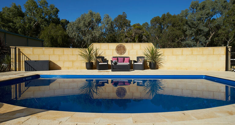 limestone retaining wall in backyard