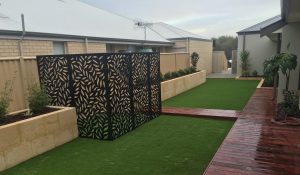 newly built Limestone wall in Perth backyard