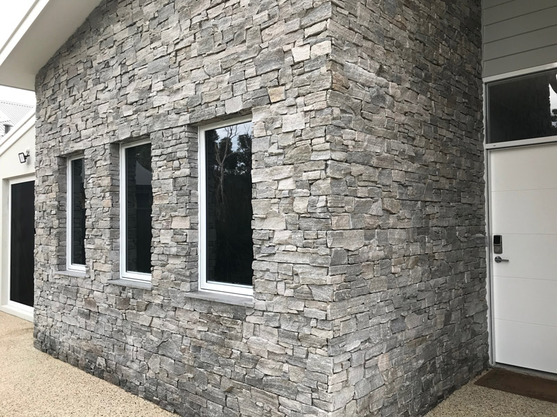 stone wall feature outside of a perth home
