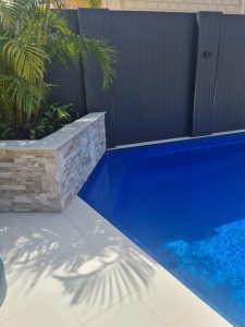 Random Pearl stone cladding adding texture to Perth pools